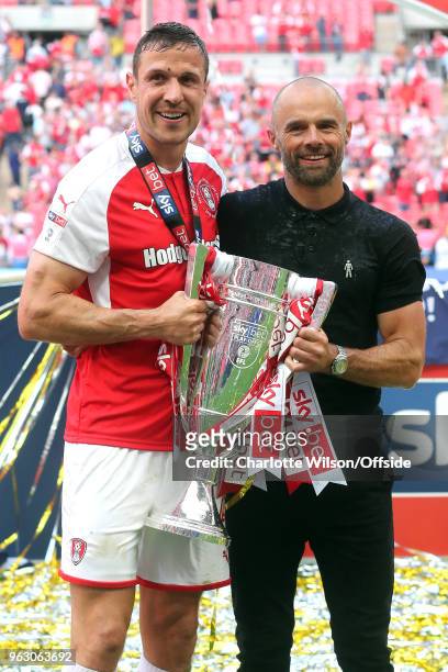 Rotherham captain Richard Wood and manager Paul Warne pose with the trophy during the Sky Bet League One Play Off Semi Final:Second Leg between...