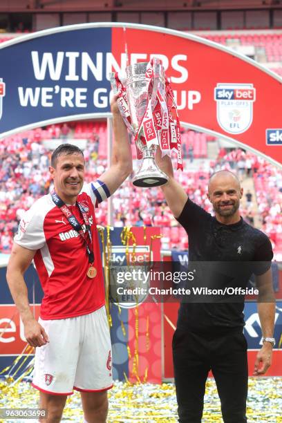 Rotherham captain Richard Wood and manager Paul Warne pose with the trophy during the Sky Bet League One Play Off Semi Final:Second Leg between...