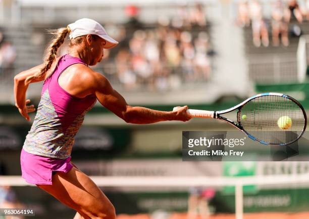 Yulia Putintseva of Kazakhstan hits a forehand to Johanna Konta of Great Britainn in the first round of the French Open at Roland Garros on May 27,...