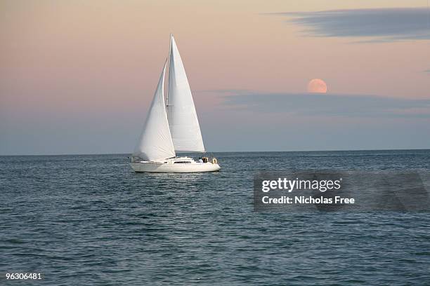 evening sailing - sailing ship night stock pictures, royalty-free photos & images