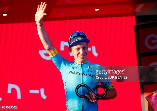 Colombia's rider of team Astana Miguel Angel Lopez, 3rd placed in the general classification, celebrates on the podium after the 21st and last stage...