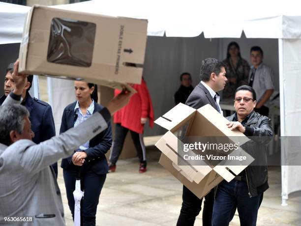 Election judges show empty official ballot boxes during the 2018 Presidential Elections in Colombia on May 27, 2018 in Bogota, Colombia.