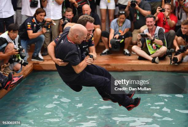 Adrian Newey, the Chief Technical Officer of Red Bull Racing and Red Bull Racing Team Principal Christian Horner celebrate the race win of Daniel...