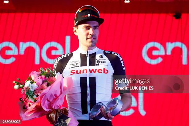 Netherlands' rider of team Sunweb Tom Dumoulin, 2nd placed in the general classification, celebrates on the podium after the 21st and last stage of...