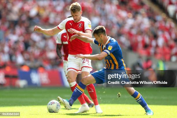 Michael Smith of Rotherham and Shrewsbury captain Mat Sadler battle for the ball during the Sky Bet League One Play Off Semi Final:Second Leg between...