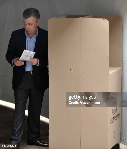 President of Colombia Juan Manuel Santos casts his vote at the polling station during the 2018 Presidential Elections in Colombia on May 27, 2018 in...