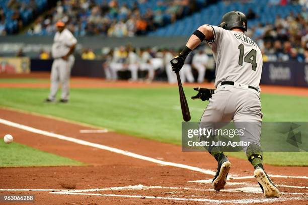 Craig Gentry of the Baltimore Orioles hits a bunt single in the first inning against the Baltimore Orioles on May 27, 2018 at Tropicana Field in St...