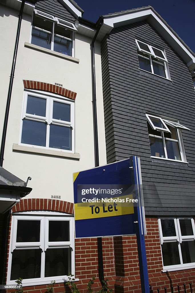 A yellow and blue to let sign outside a building