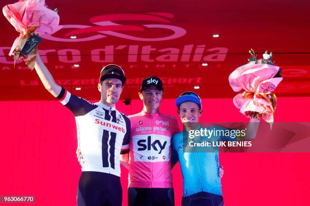 Pink jersey and winner, Britain's rider of team Sky Christopher Froome , poses with 2nd placed, Netherlands' rider of team Sunweb Tom Dumoulin and...