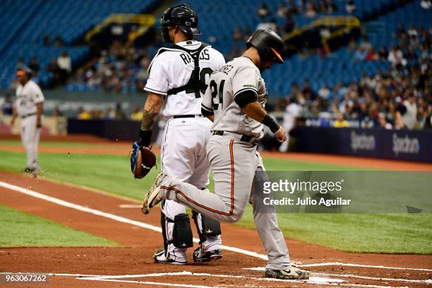 Pedro Alvarez of the Baltimore Orioles scores in the first inning against the Baltimore Orioles on May 27, 2018 at Tropicana Field in St Petersburg,...