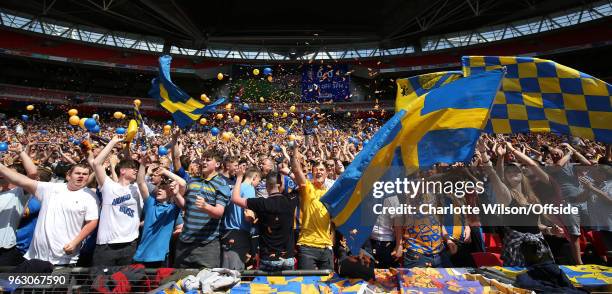 Shrewsbury fans wave flags and throw balloons and ticker tape during the Sky Bet League One Play Off Semi Final:Second Leg between Rotherham United...