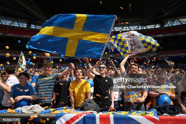 Shrewsbury fans wave flags and throw balloons and ticker tape during the Sky Bet League One Play Off Semi Final:Second Leg between Rotherham United...