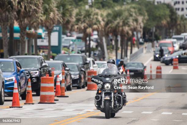 Police officer rides down N. Ocean Blvd. On May 27, 2018 in Myrtle Beach, South Carolina. Also known as Atlantic Beach Bikefest and Black Bikers...