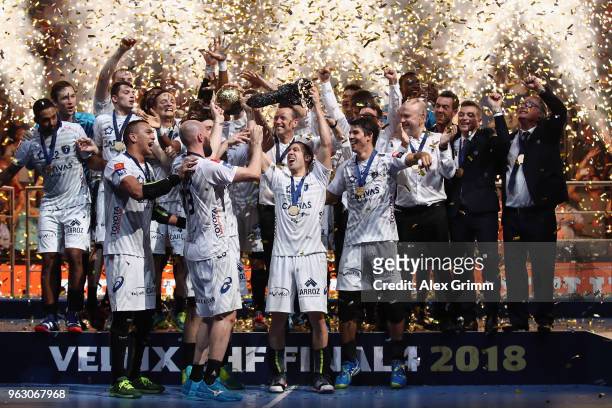 Team captain Michael Guigou of Montpellier lifts the trophy after his team won the EHF Champions League Final 4 Final match between Nantes HBC and...