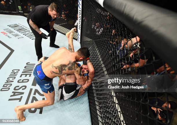 Makwan Amirkhani of Kurdistan punches Jason Knight in their featherweight bout during the UFC Fight Night event at ECHO Arena on May 27, 2018 in...