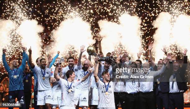 Team captain Michael Guigou of Montpellier lifts the trophy after his team won the EHF Champions League Final 4 Final match between Nantes HBC and...