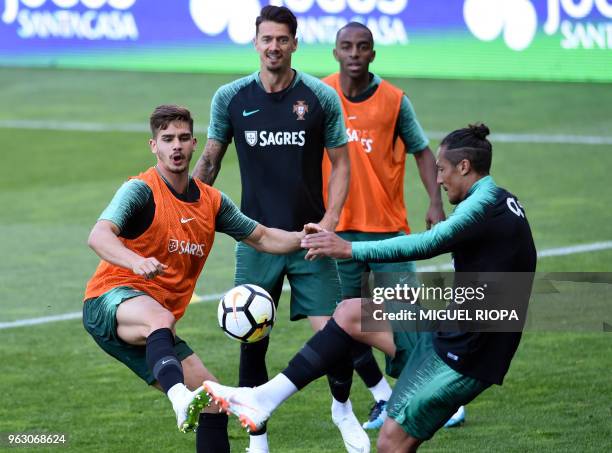 Portugal's forward Andre Silva, defender Jose Fonte, defender Ricardo Pereira and defender Bruno Alves take part in a training session at the...