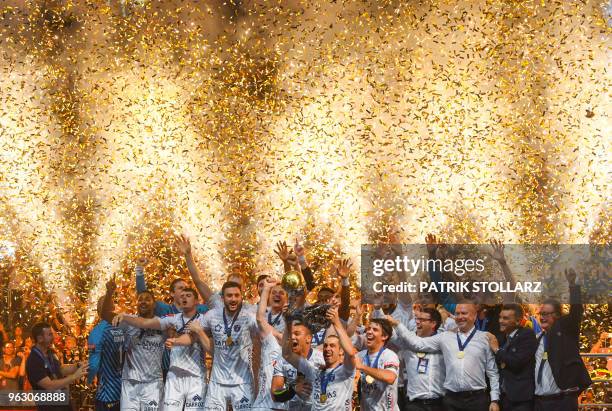 Montpellier's players celebrate with the trophy after winning the Final match HBC Nantes vs HB Montpellier at the EHF Pokal men's Champions League...