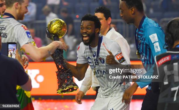 Montpellier's Arnaud Bingo and his teammates celebrate with the trophy after winning the Final match HBC Nantes vs HB Montpellier at the EHF Pokal...