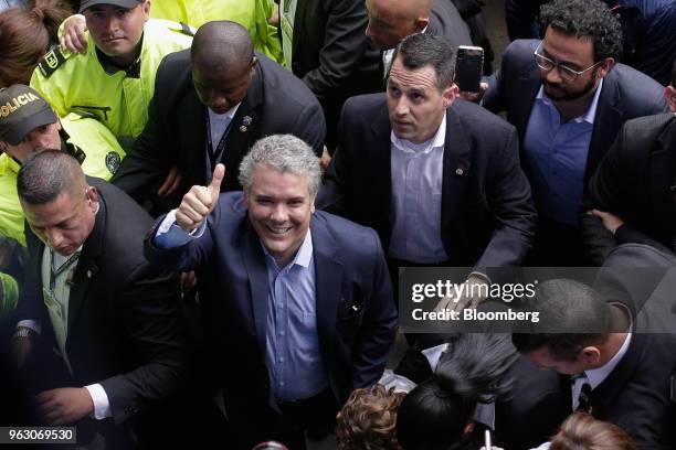 Ivan Duque, presidential candidate for the Democratic Center Party, gives a thumbs up after casting his ballot at the National Pedagogical Institute...