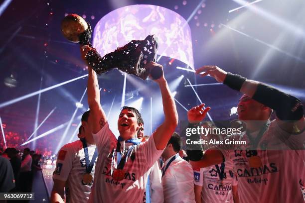 Diego Simonet and team mates of Montpellier present the trophy to the fans after winning the EHF Champions League Final 4 Final match between Nantes...