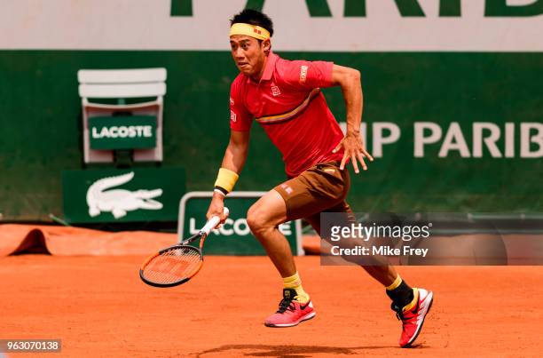Kei Nishikori of Japan runs for a short ball against Maxime Janvier of France in the first round of the French Open at Roland Garros on May 27, 2018...