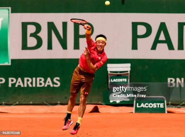 Kei Nishikori of Japan serves to Maxime Janvier of France in the first round of the French Open at Roland Garros on May 27, 2018 in Paris, France.