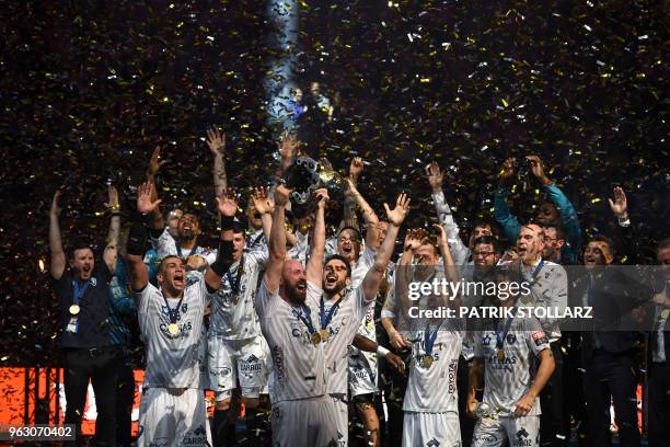 Montpellier's players celebrate with the trophy after winning the Final match HBC Nantes vs HB Montpellier at the EHF Pokal men's Champions League...