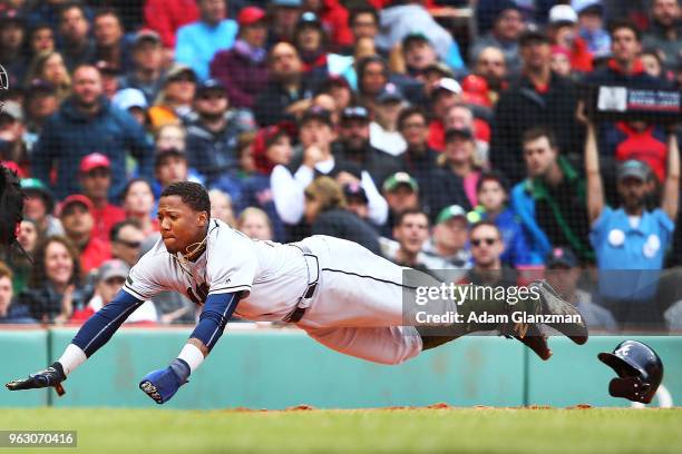 Ronald Acuna Jr. #13 of the Atlanta Braves slides safely head first into home plate in the fifth inning of a game against the Boston Red Sox at...