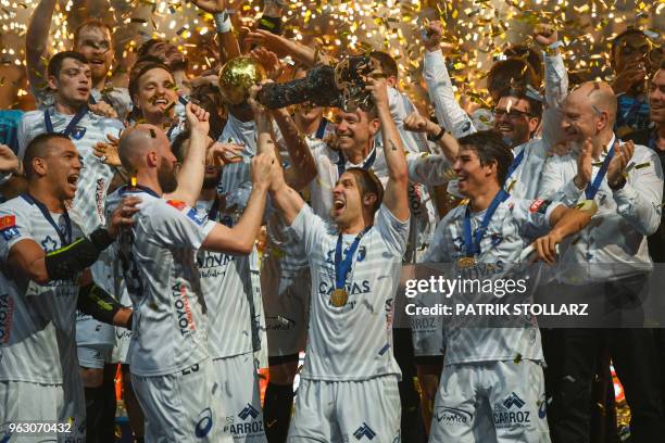 Montpellier's players celebrate with the trophy after winning the Final match HBC Nantes vs HB Montpellier at the EHF Pokal men's Champions League...