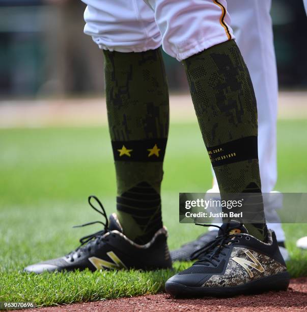 Detailed view of the special Memorial Day baseball cleats worn by Steven Brault of the Pittsburgh Pirates before the game against the St. Louis...