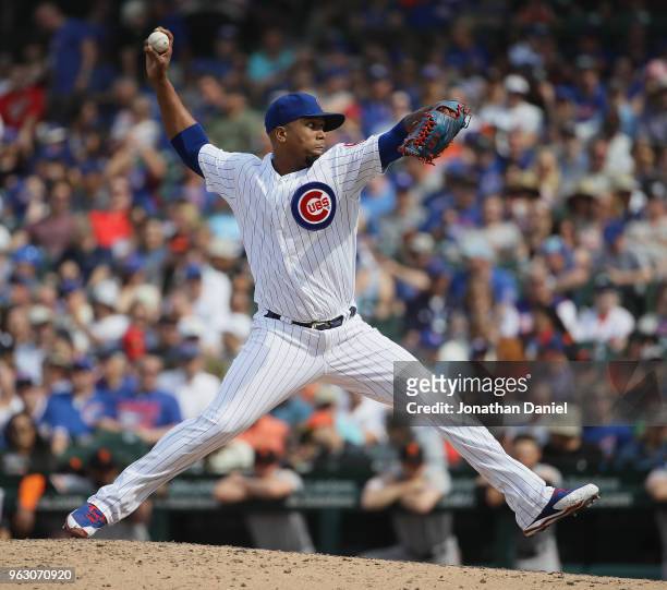 Pedro Strop of the Chicago Cubs pitches against the San Francisco Giants at Wrigley Field on May 25, 2018 in Chicago, Illinois. The Cubs defeated the...