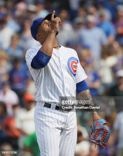Pedro Strop of the Chicago Cubs leaves the filed after pitching against the San Francisco Giants at Wrigley Field on May 25, 2018 in Chicago,...