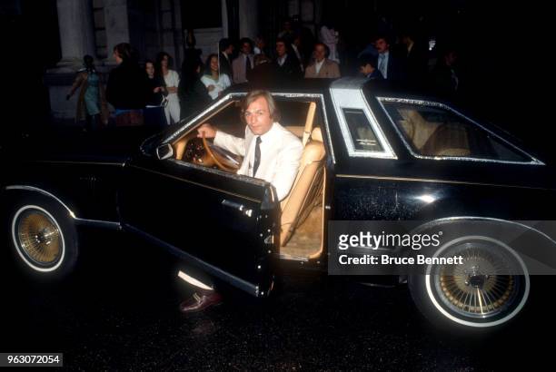 Guy LaFleur of the Montreal Canadiens pulls up in a Lincoln Continental Town car circa 1980's.