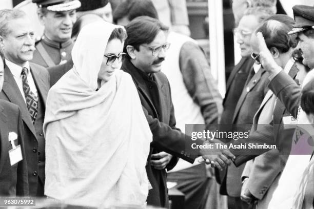 Pakistani Prime Minister Benazir Bhutto is seen on arrival ahead of the Funeral of late Emperor Hirohito at Haneda Airport on February 23, 1989 in...