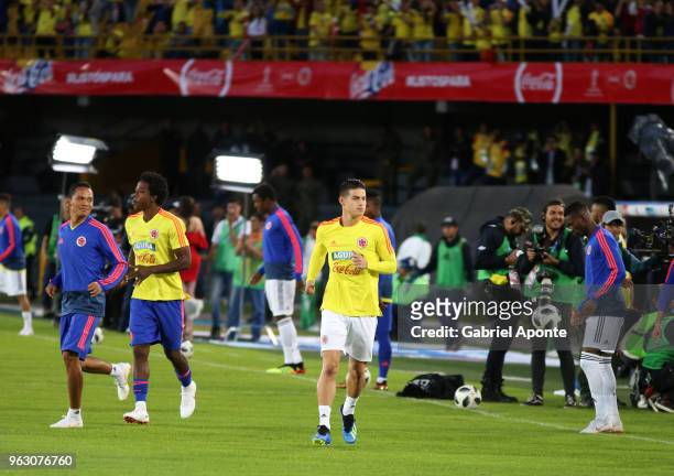 James Rodriguez , Carlos Sanchez and Carlos Bacca , of Colombia train during a training session open to the public as part of the preparation for...