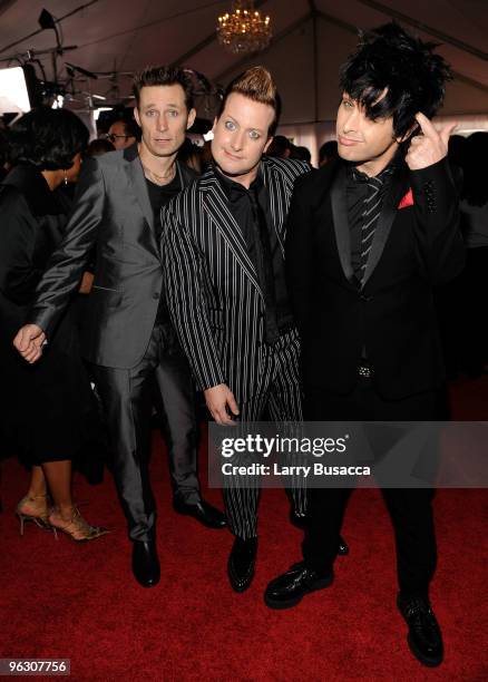 Musicians Mike Dirnt, Tre Cool and Billie Joe Armstrong of the band Green Day arrive at the 52nd Annual GRAMMY Awards held at Staples Center on...