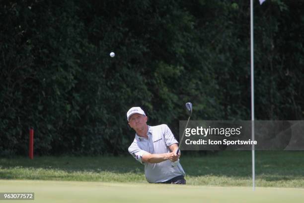 Mackenzie Hughes chips onto the 11th green during the final round of the Fort Worth Invitational on May 27, 2018 at Colonial Country Club in Fort...