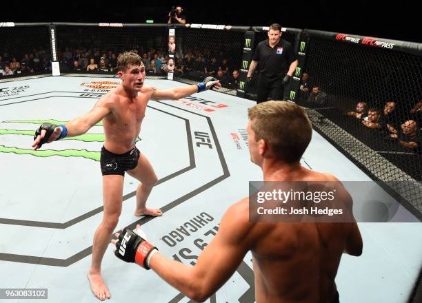 Darren Till of England taunts Stephen Thompson in their welterweight bout during the UFC Fight Night event at ECHO Arena on May 27, 2018 in...