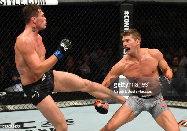 Darren Till of England kicks Stephen Thompson in their welterweight bout during the UFC Fight Night event at ECHO Arena on May 27, 2018 in Liverpool,...