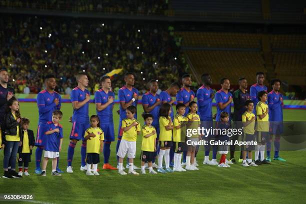 Players of Colombia sign their National Anthem prior to a training session open to the public as part of the preparation for FIFA World Cup Russia...