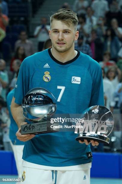 Real Madrid's captain Felipe Reyes shows the 2017-18 Turkish Airlines EuroLeague trophy to the public before the start of the Endesa League play off...