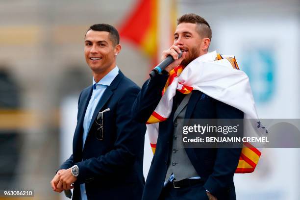 Real Madrid's Portuguese forward Cristiano Ronaldo and Real Madrid's Spanish defender Sergio Ramos celebrate at Cibeles square in Madrid on May 27,...