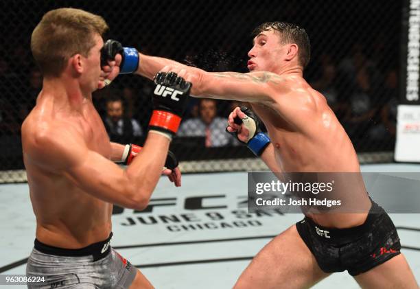 Darren Till of England punches Stephen Thompson in their welterweight bout during the UFC Fight Night event at ECHO Arena on May 27, 2018 in...