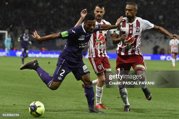 Toulouse's French defender Kelvin Amian vies with Ajaccio's French midfielder Yann Boe-Kane and French forward Thibault Vialla during the French...