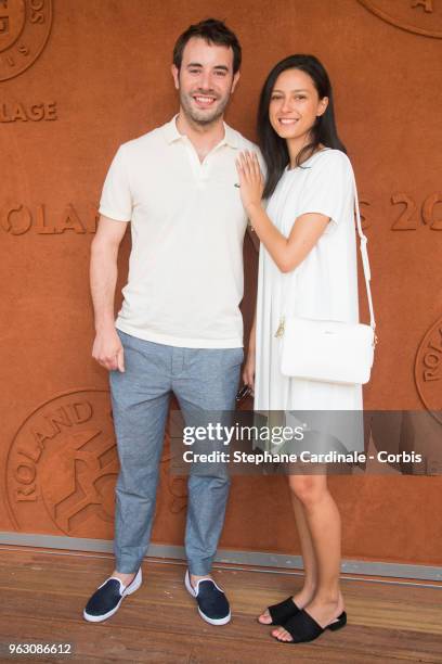 Yaniss Lespert and his companion Betina Orsetti attend the 2018 French Open - Day One at Roland Garros on May 27, 2018 in Paris, France.