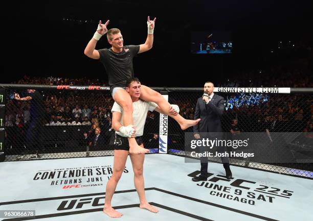 Darren Till of England puts Stephen Thompson on his shoulders in their welterweight bout during the UFC Fight Night event at ECHO Arena on May 27,...