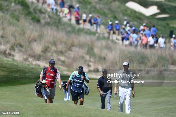 Tim Petrovic and Scott McCarron walk up the eighth fairway during the final round of the Senior PGA Championship presented by KitchenAid at the Golf...