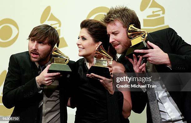 Dave Haywood, Hillary Scott and Charles Kelley of the group Lady Antebellum pose in the press room at the 52nd Annual GRAMMY Awards held at Staples...