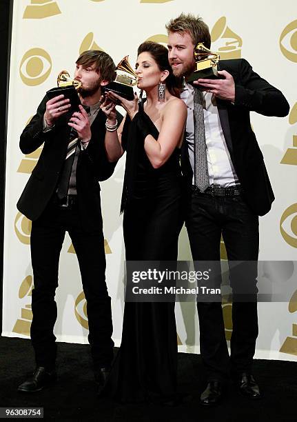 Dave Haywood, Hillary Scott and Charles Kelley of the group Lady Antebellum pose in the press room at the 52nd Annual GRAMMY Awards held at Staples...